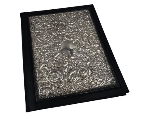 Modern silver mounted leather writing case, with repousse floral and foliate decoration to the silver cover, hallmarked Laure