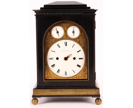 FLOCKHART KINGS ST. COVENT GARDEN LONDONA Regency Ebonised and brass bound chamfer-top BRACKET CLOCK the 6" arched gilt brass