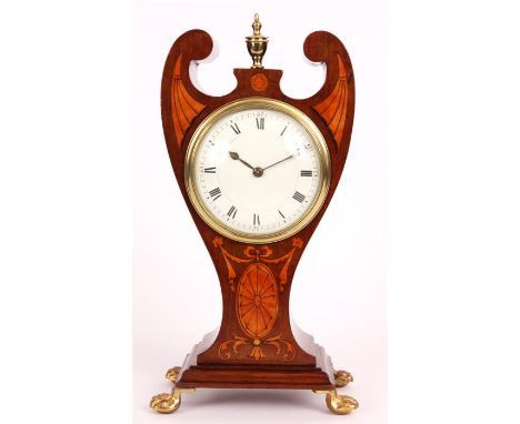 An Edwardian marquetry inlaid Mahogany urn-shaped MANTEL CLOCK&nbsp;with scrolled cut out pediment and centre brass finial, o