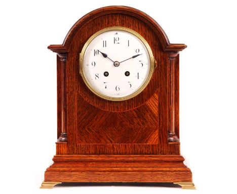 A late 19th Century inlaid Oak MANTEL/BRACKET CLOCK&nbsp;the arch-top case with half reeded quarter columns and moulded base 