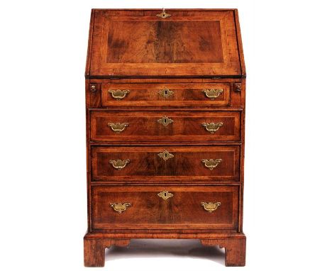An early 18th Century unusually small cross-banded and boxwood strung Walnut BUREAU with stepped fitted interior of small dra