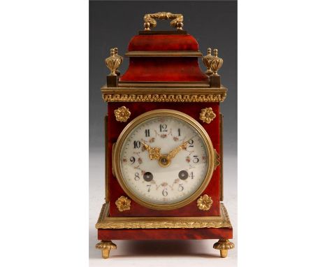 A late 19th Century French Red Tortoiseshell and Brass MANTEL CLOCK with corner finials and folding handle. The convex ivorin