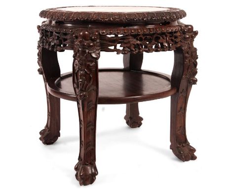 A good late 19th Century Chinese carved hardwood STAND with inset pink marble top within a scolloped carved border on four sq