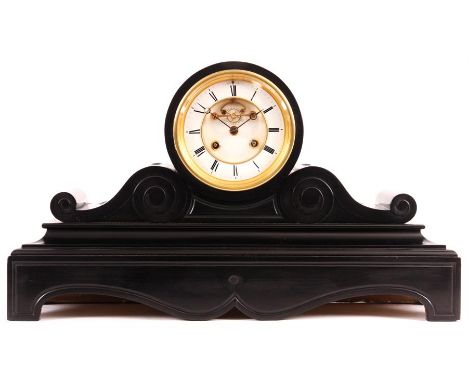 A late 19th Century large black slate French MANTEL CLOCK&nbsp;the drum-head case with scrolled side pieces and cut out wavey