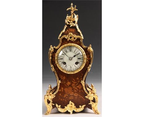 A good 19th Century French Louis XVI style Rosewood and marquetry inlaid MANTEL CLOCK with gilt rococo brass mounts the cream