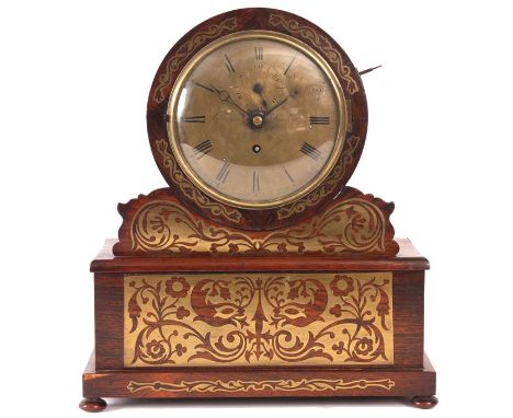 GANTHONY, LONDONA late Regency brass inlaid Rosewood LIBRARY/MANTEL CLOCK the fret cut drum-head case on a platform box base 