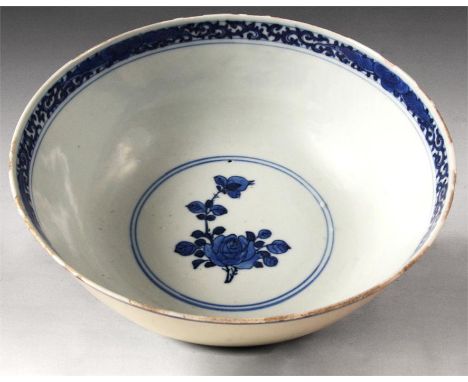 An 18th/19th Century Chinese Blue and White BOWL with scroll decorated inner rim and rose spray centre; the exterior decorate