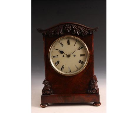 An Early Victorian flame veneered Mahogany 8 day BRACKET CLOCK, with wavy top pediment and applied leaf and flower head carvi