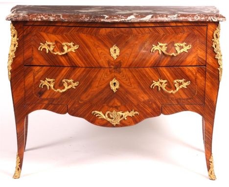 A mid 19th century French Ormolu mounted Kingwood bomb shaped serpentine COMMODE with thick-cut rouge coloured marble top abo