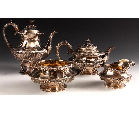 A good George IV four piece Silver TEA SERVICE each piece of scalloped footed form beneath a panelled body embossed with flow