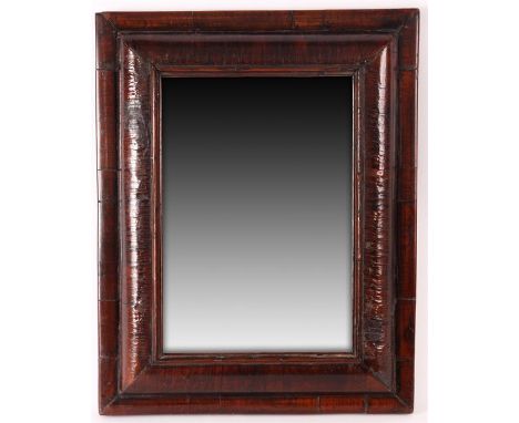 A William and Mary Walnut&nbsp;CUSHION FRAMED HANGING MIRROR&nbsp;with short grained D moulded border enclosing a fitted look