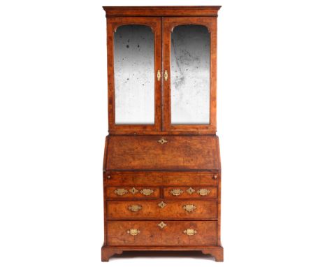 A good Queen Anne herringband strung and cross banded figured Walnut BUREAU BOOKCASE the shelved fitted upper part with bevel