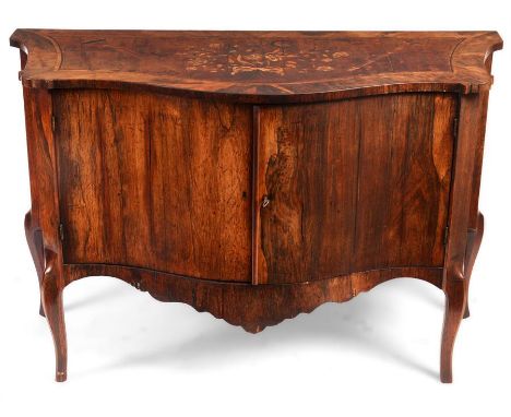 A George III English Rosewood SERPENTINE COMMODE in the manner of John Cobb with broad cross-banded top enclosing a double ba