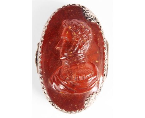 An early 19th Century silver metal mounted&nbsp;Brunswick Amber SNUFF BOX the lid modelled in high relief with a bust portrai