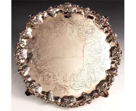 A fine early Victorian large circular Silver SALVER with ornate scalloped chased fruiting vine leaf border on three matching 