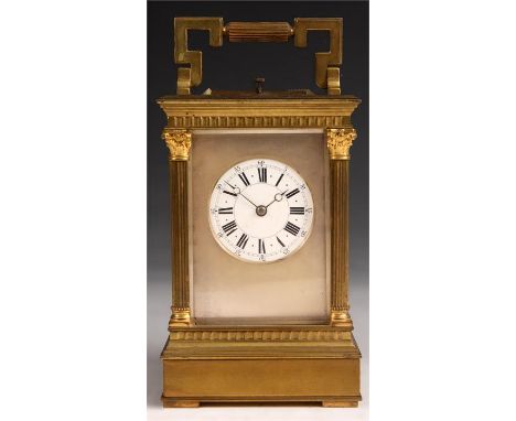 A good late 19th Century French Brass CARRIAGE CLOCK REPEATER of large size with ribbed angular folding handle and corinthian