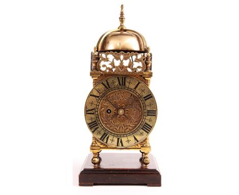 A 19th Century English Fusee small Brass LANTERN CLOCK of 17th Century design with Roman chapter ring and tulip engraved cent