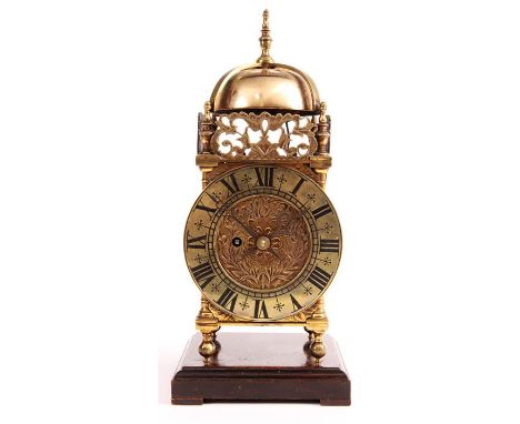 A 19th Century English Fusee small Brass LANTERN CLOCK of 17th Century design with Roman chapter ring and tulip engraved cent