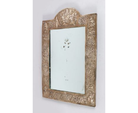A BENGAL SILVER EASEL MIRROR, repousse with figures, scrolls and foliage, 45cm high, 30cm wide.