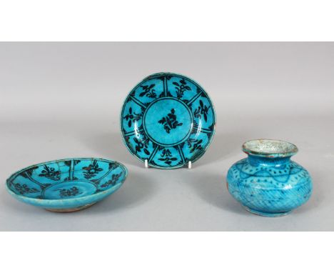TWO 17TH CENTURY PERSIAN TURQUOISE GLAZED POTTERY SAUCERS and a similar ink pot, saucer 13cm diameter, pot 6cm high. D&amp;S.