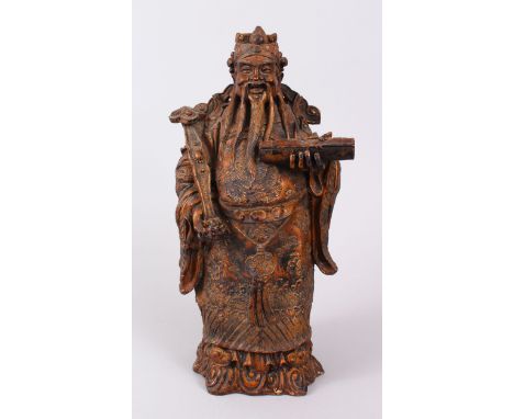 A FINE CHINESE WOOD AND GILT FIGURE DEPICTING A BEARDED CHINESE GOD, holding a Ruyi sceptre in one hand, the other with a scr