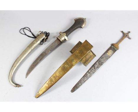 A MOROCCAN KUMAYA DAGGER and a North African brass dagger (2).