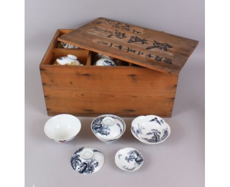 A QUANTITY OF ORIENTAL TEA BOWLS AND SAUCERS in a wooden box..