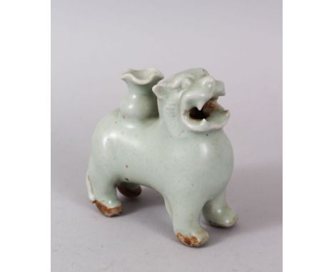 RARE CHINESE CELADON GLAZED JOSS STICK HOLDER, in the form of a foo dog, possibley song dynasty, 10cm high, 10cm wide.