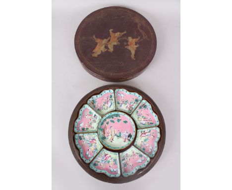A CHINESE ENAMEL NINE PIECE HORS D'OEUVRES SET in a lacquer case. 29cm diameter.