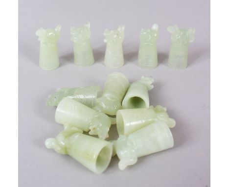 A SET OF TWELVE CHINESE JADE THIMBLES.