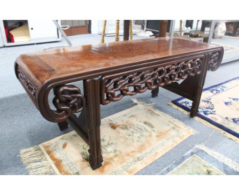 A LARGE CHINESE HARDWOOD OPIUM COFFEE TABLE, with pierced frieze and scroll end, late 19th century/early 20th century, 49.5cm