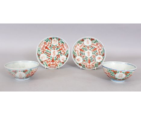 A PAIR OF 19TH CENTURY CHINESE PROVINCIAL IRON-RED &amp; GREEN ENAMELLED PORCELAIN TEA BOWLS &amp; SAUCERS, each piece painte