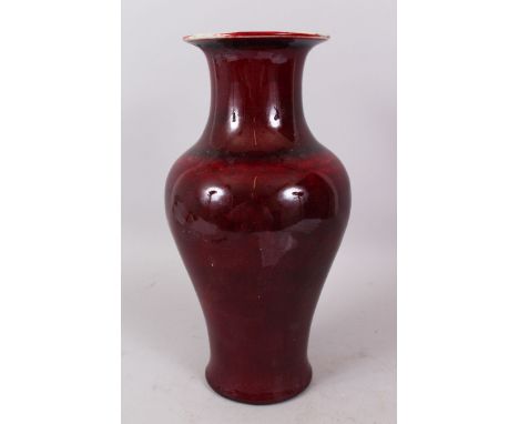 A CHINESE POTTERY SANG DE BOEUF VASE. 36cm high.