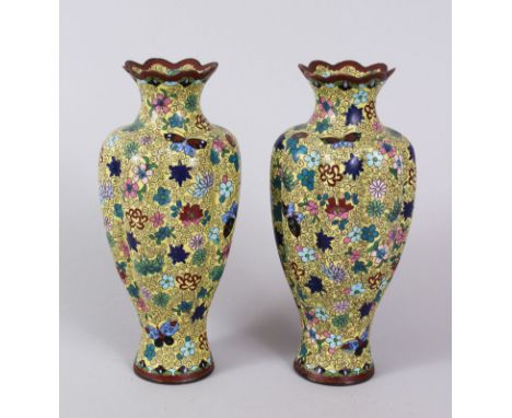 A PAIR OF JAPANESE YELLOW GROUND RIBBED` CLOISONNE ENAMEL VASES. 18cm high.