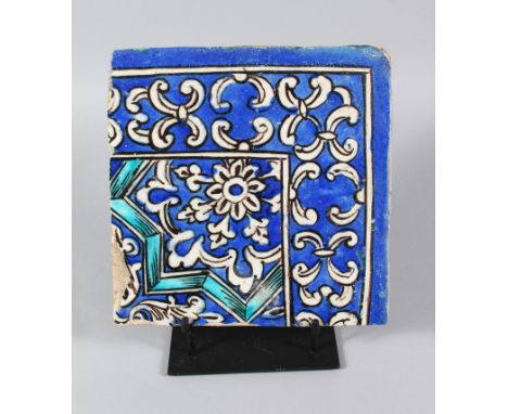 A PERSIAN QAJAR BLUE AND WHITE CORNER TILE, 19TH CENTURY, 21cm x 21cm.