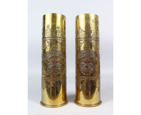 A PAIR OF TRENCH ART BRASS SHELL CASES, PROBABLY FIRST WORLD WAR PERIOD, with Islamic silver and copper inlaid decoration, ea