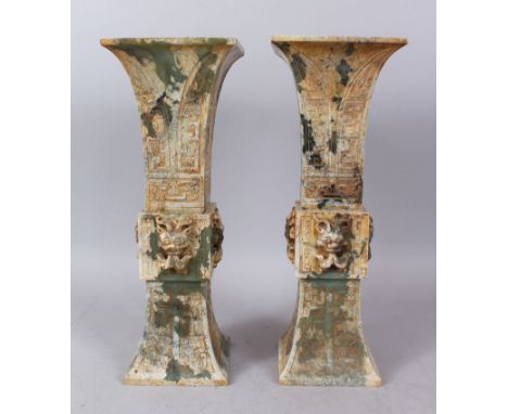 A GOOD PAIR OF CHINESE ARCHAIC JADE VASES. 37cm high.