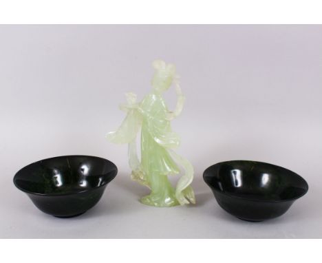 A PAIR OF RED JADE CIRCULAR BOWLS, 13cm diameter and A BOENITE FIGURE, 19cm high. (3).