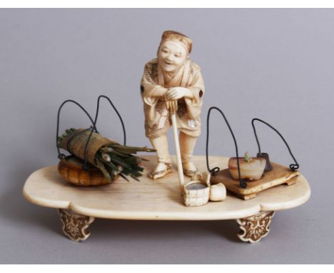 A LOVELY JAPANESE IVORY &amp; SHIBAYAMA OKIMONO of an old man stood leaning in to his stick, his gown inlaid with semi-precio