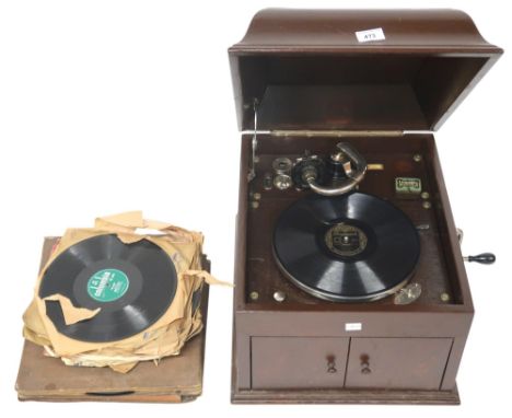 A HMV GRAMOPHONE MODEL 109, in an oak case with associated spare needle tins by Columbia. And a quantity of 78rpm records of 