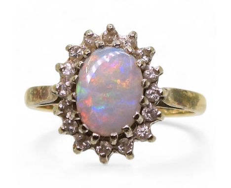 A 9ct gold opal and diamond cluster ring, size K, weight 2.4gms Condition Report:Available upon request