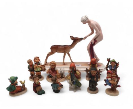 A Katzhutte model of a girl feeding a deer, together with assorted Hummel figures Condition Report:Deer has been off base and