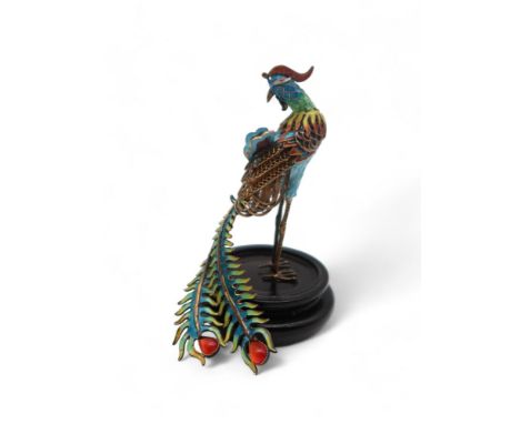 A Chinese cloisonne enamel model of a phoenix, on base with case, 9cm high Condition Report:Available upon request