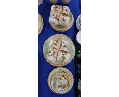 A Nautilus porcelain tea service painted with poppies, some with number 1/198, comprising nice cups, ten saucers and plates a