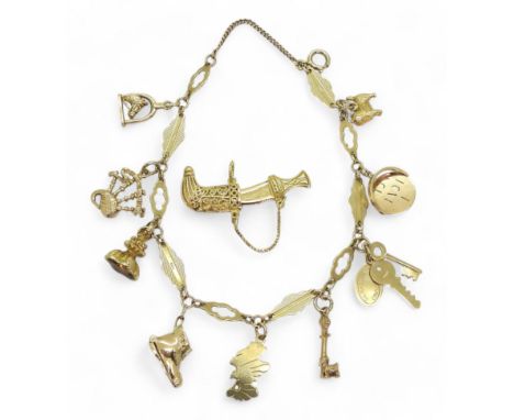 A 9ct gold fancy leaf shaped link charm bracelet with eight 9ct gold charms to include a horse &amp; stirrup, bagpipes and a 