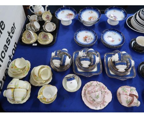 A Wedgwood W868 pattern tea set comprising twelve cups, saucers and plates, milk jug and sugar bowl, Grafton and Tuscan tea w