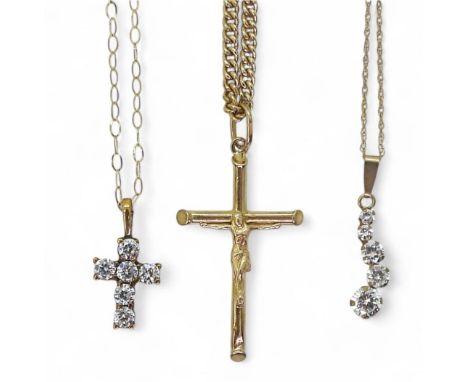 Two 9ct gold cz set pendants, and a 9ct gold crucifix with a gold plated chain. Weight combined 2.5gms, without gold plated c