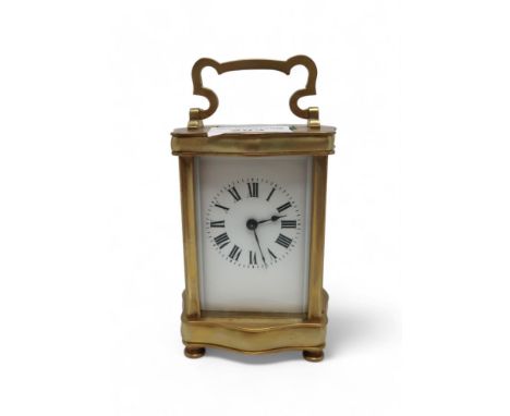 A brass and glass carriage clock Condition Report:winds and ticks