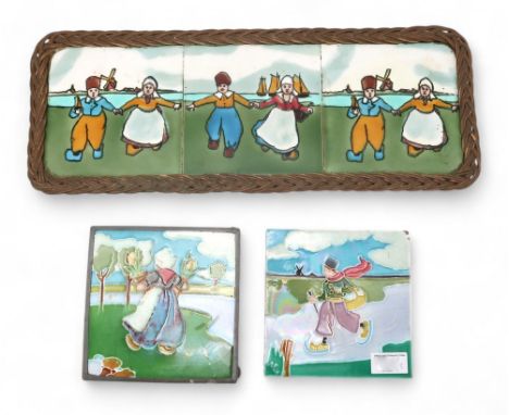 An English tube lined tile depicting a Dutch boy skating on a frozen river, another mounted tile of a Dutch girl holding tuli