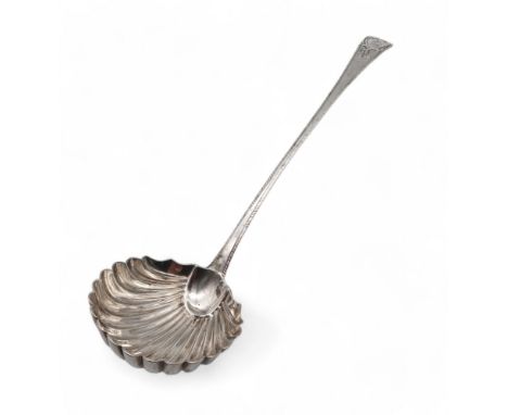 A George III silver soup ladle, by London 1775, in the feathered edge Old English pattern, with a shell bowl, engraved with a